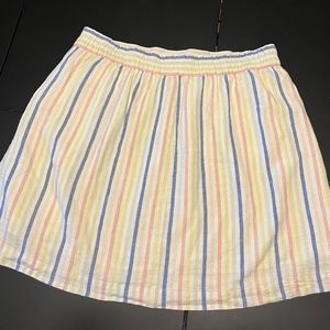 White skirt with blue, pink, yellow stripes